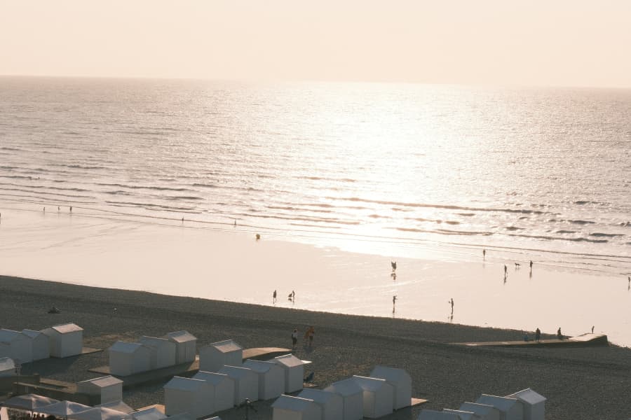 The beach cabins of Mers-les-Bains at sunset